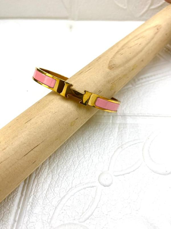 Pulsera De Acero Rigida Hermes Dorada Diseño H Rosado