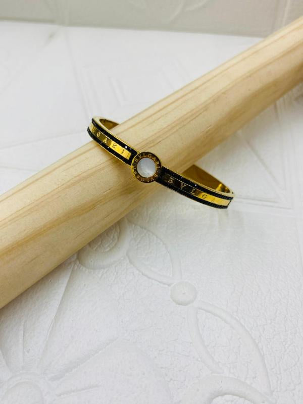 Pulsera De Acero Rigida Bvlgari Diseño Piedras Negras Dorado