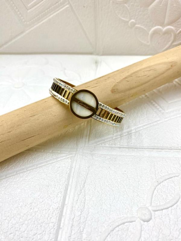 Pulsera De Acero Rigida Cartier Diseño Circulo Con Perlas Dorado