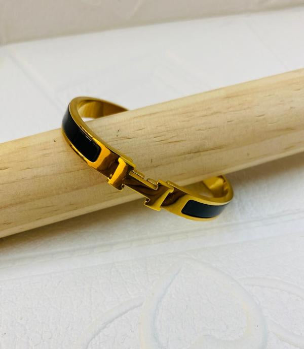 Pulsera De Acero Rigida Hermes Dorada Diseño H Negro