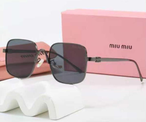 LENTES DE SOL MIU MIU 58087 NEGRO